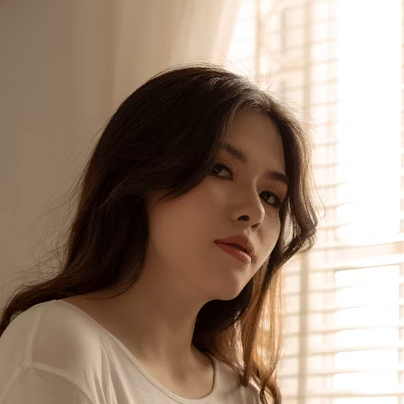 Woman looking thoughtfully by window