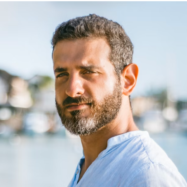 Bearded man smiling outdoors portrait